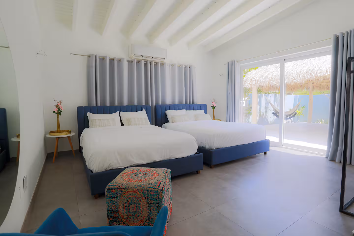 Living room — bright open plan with pool views